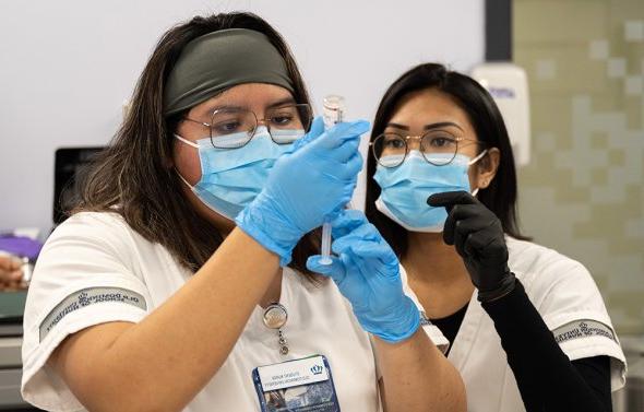 Nursing student with instructor